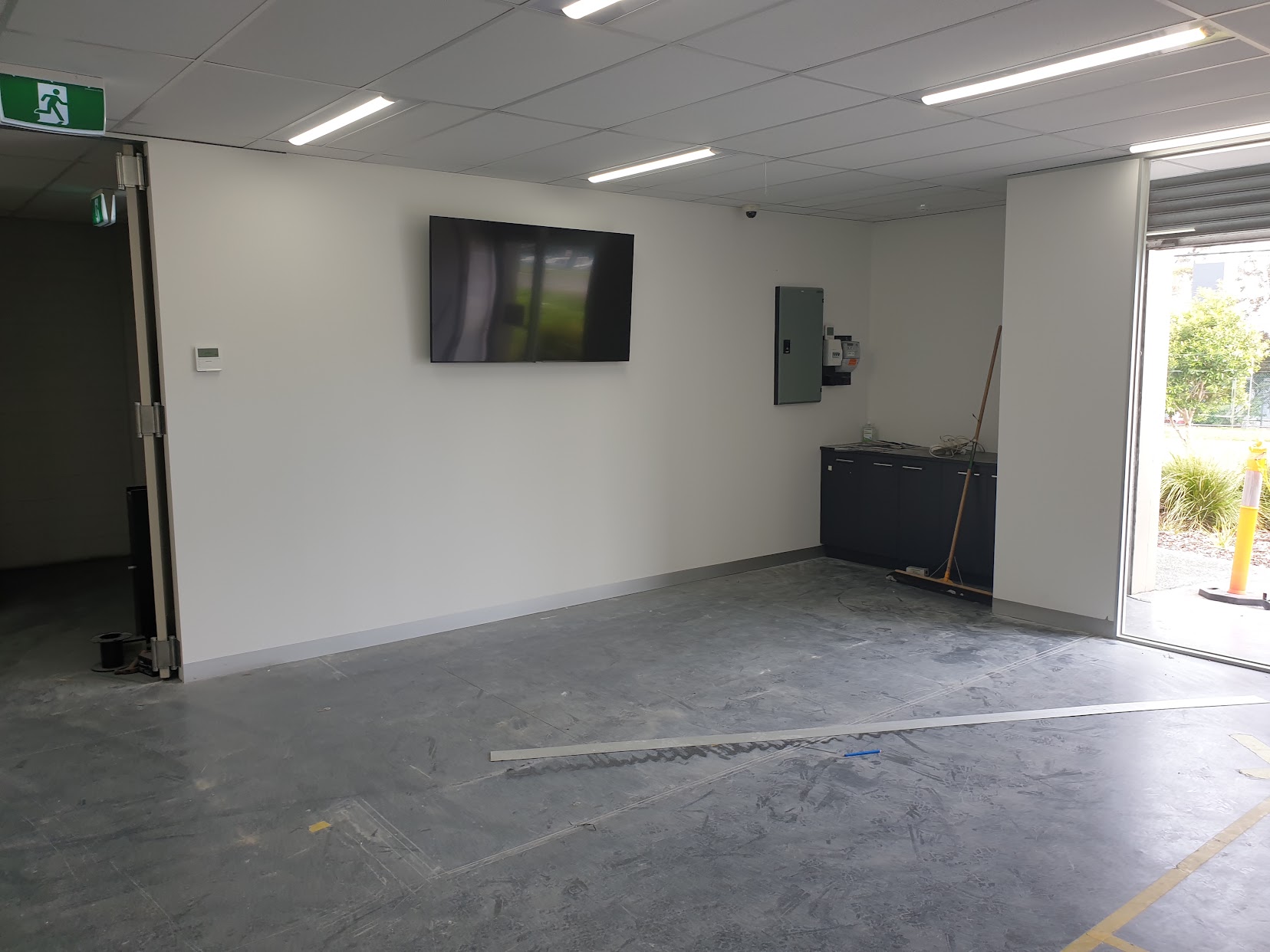 Finished commercial office interior with painted walls and skirting