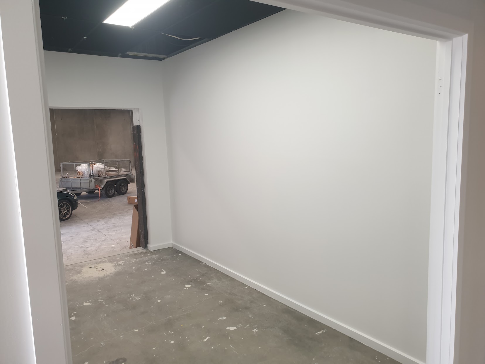 Commercial interior wall and dark ceiling painting during a fit-out